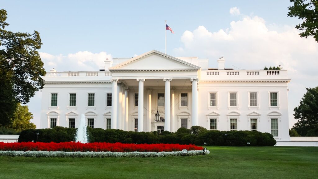 The White House - The official residence of the President of the United States in Washington, D.C. lit by the setting sun in the evening.